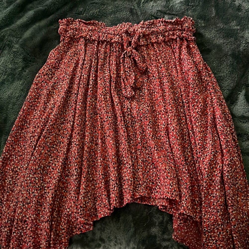 Pink/orange skirt with blue and white spots. Fairly used